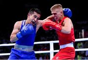 16 June 2015; Kurt Walker, Ireland, right, exchanges punches with Nazirov Bakhtovar, Russia, during their Men's Boxing Bantam 56kg Round of 32 bout. 2015 European Games, Crystal Hall, Baku, Azerbaijan. Picture credit: Stephen McCarthy / SPORTSFILE