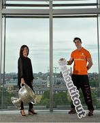 16 June 2015; Dublin football star Michael Darragh MacAuley with Lisa Comerford, Director of Brand and Communications, eircom, before they joined eircom’s GAA ambassadors Tomás O’Sé, Ciaran Whelan, David Brady and Brendan Devenney in eircom’s head office in Dublin to launch their online platform for supporters of this summer’s GAA Football All-Ireland Senior Championship. The GAA hub, www.eircom.ie/gaa, will see the introduction of a new feature where fans can record and share their views on players throughout the championship via a new audio social network BOAST and be in with a chance to win tickets to the All-Ireland Senior Football Final. #shoutitout. eircom Head Office, HSQ, Dublin. Picture credit: Brendan Moran / SPORTSFILE