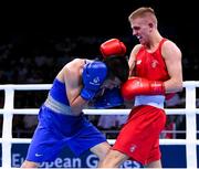 16 June 2015; Kurt Walker, Ireland, right, exchanges punches with Nazirov Bakhtovar, Russia, during their Men's Boxing Bantam 56kg Round of 32 bout. 2015 European Games, Crystal Hall, Baku, Azerbaijan. Picture credit: Stephen McCarthy / SPORTSFILE