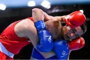 16 June 2015; Nazirov Bakhtovar, Russia, right, exchanges punches with Kurt Walker, Ireland, during their Men's Boxing Bantam 56kg Round of 32 bout. 2015 European Games, Crystal Hall, Baku, Azerbaijan. Picture credit: Stephen McCarthy / SPORTSFILE