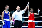 16 June 2015; Nicolae Andreiana, Romania, is announced victorious over Diego Ferrer Pereira, Spain, by referee Mykola Karakulov during their Men's Boxing Bantam 56kg Round of 32 bout. 2015 European Games, Crystal Hall, Baku, Azerbaijan. Picture credit: Stephen McCarthy / SPORTSFILE