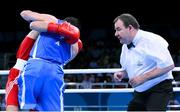 16 June 2015; Referee Micky Gallagher, Ireland, watches Riccardo D'Andrea, Italy, and Iurii Shestak, Ukriane, during their Men's Boxing Bantam 56kg Round of 32 bout. 2015 European Games, Crystal Hall, Baku, Azerbaijan. Picture credit: Stephen McCarthy / SPORTSFILE