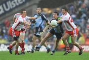 16 August 2008; Colin Moran, Dublin, gets the ball away despite the attention of Tommy McGuigan, left, and Colin Holmes, Tyrone. GAA Football All-Ireland Senior C'ship Quarter-Final, Dublin v Tyrone, Croke Park, Dublin. Picture credit: Stephen McCarthy / SPORTSFILE