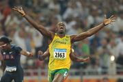 20 August 2008; Usain Bolt, of Jamaica, celebrates winning the Men's 200m Final in a new world record time of 19.30 seconds. Beijing 2008 - Games of the XXIX Olympiad, National Stadium, Olympic Green, Beijing, China. Picture credit: Brendan Moran / SPORTSFILE