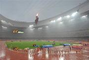 21 August 2008; The Women's 20km Walk proceeds around the track in the National Stadium before heading out onto the walking course during heavy rain. Beijing 2008 - Games of the XXIX Olympiad, National Stadium, Olympic Green, Beijing, China. Picture credit: Brendan Moran / SPORTSFILE