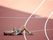 22 August 2008; Jamie Costin, 2047, Ireland, lies on the track after the Men's 50km Walk Final, where he finished 44th in a time of 4:15.16. Beijing 2008 - Games of the XXIX Olympiad, National Stadium, Olympic Green, Beijing, China. Picture credit: Brendan Moran / SPORTSFILE