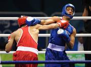 22 August 2008; Darren Sutherland, Ireland, scores a point against James Degale, in blue, Great Britain, during their semi-final bout in the Middleweight, 75kg, contest. Beijing 2008 - Games of the XXIX Olympiad, Beijing Workers' Gymnasium, Olympic Green, Beijing, China. Picture credit: Brendan Moran / SPORTSFILE