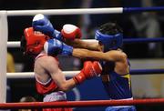 22 August 2008; Paddy Barnes, Ireland, in action against Shiming Zou, in blue from China, during their semi-final bout in the Light Fly weight, 48kg, contest. Beijing 2008 - Games of the XXIX Olympiad, Beijing Workers Gymnasium, Olympic Green, Beijing, China. Picture credit: Ray McManus / SPORTSFILE