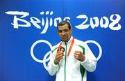 23 August 2008; Ireland's Darren Sutherland strikes a pose with his Olympic Bronze Medal which was presented after the final of the Middleweight, 75kg, division. Beijing 2008 - Games of the XXIX Olympiad, Beijing Workers' Gymnasium, Olympic Green, Beijing, China. Picture credit: Ray McManus / SPORTSFILE