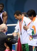 23 August 2008; Ireland's Darren Sutherland is presented with an Olympic Bronze Medal by Patrick Hickey, president of the Olympic Council of Ireland and president of the European Olympic Committee, after the final of the the Middleweight, 75kg, division. Beijing 2008 - Games of the XXIX Olympiad, Beijing Workers' Gymnasium, Olympic Green, Beijing, China. Picture credit: Ray McManus / SPORTSFILE