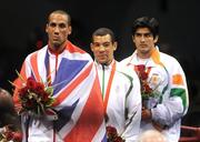 23 August 2008; Medal winners James Degale, gold, Great Britain, Darren Sutherland, bronze, Ireland, and Vijendar Kumar, silver, India, stand for the Nation Anthem after the medal presentation for the final of the Middleweight, 75kg, division. Beijing 2008 - Games of the XXIX Olympiad, Beijing Workers' Gymnasium, Olympic Green, Beijing, China. Picture credit: Ray McManus / SPORTSFILE