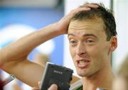 23 August 2008; Alistair Cragg, Ireland, speaking to journalists after the Men's 5000m Final, which he failed to finish. Beijing 2008 - Games of the XXIX Olympiad, National Stadium, Olympic Green, Beijing, China. Picture credit: Brendan Moran / SPORTSFILE