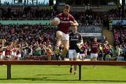 14 June 2015; Galway's Paul Conroy jumps the bench before sitting for the pre-match team photograph. Connacht GAA Football Senior Championship Semi-Final, Galway v Mayo. Pearse Stadium, Galway. Picture credit: Piaras Ó Mídheach / SPORTSFILE