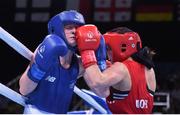 19 June 2015; Ceire Smith, Ireland, left, exchanges punches with Camilla Johansen, Norway, during their Women's Boxing Fly 51kg Round of 16 bout. 2015 European Games, Crystal Hall, Baku, Azerbaijan. Picture credit: Stephen McCarthy / SPORTSFILE