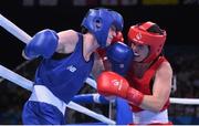 19 June 2015; Ceire Smith, Ireland, left, exchanges punches with Camilla Johansen, Norway, during their Women's Boxing Fly 51kg Round of 16 bout. 2015 European Games, Crystal Hall, Baku, Azerbaijan. Picture credit: Stephen McCarthy / SPORTSFILE