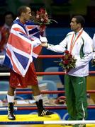 23 August 2008; Bronze medal winner Darren Sutherland, Ireland, is congratulated by James Degale, who the Gold for Great Britain, after the medal presentations for the Middleweight, 75kg, division. Beijing 2008 - Games of the XXIX Olympiad, Beijing Workers' Gymnasium, Olympic Green, Beijing, China. Picture credit: Ray McManus / SPORTSFILE