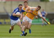 20 June 2015; Niall Donoher, Laois, in action against Tony Scullion, Antrim, supported by team-mate Mark Sweeney, behind. GAA Football All-Ireland Senior Championship, Round 1A, Laois v Antrim, O'Moore Park, Portlaoise, Co. Laois. Picture credit: Piaras Ó Mídheach / SPORTSFILE