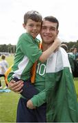 20 June 2015; Dillon Sheridan, Ireland, celebrates his side's victory with his brother after the game. This tournament is the only chance the Irish team have to secure a precious qualifying spot for the 2016 Rio Paralympic Games. 2015 CP Football World Championships, Ireland v Portuga. St. George’s Park, Tatenhill, Burton-upon-Trent, Staffordshire, United Kingdom. Picture credit: Magi Haroun / SPORTSFILE