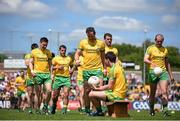 14 June 2015; Donegal captain Michael Murphy and his team-mates take a seat on the bench for their team photo. Ulster GAA Football Senior Championship Quarter-Final, Armagh v Donegal. Athletic Grounds, Armagh. Picture credit: Brendan Moran / SPORTSFILE