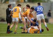20 June 2015; Brendan Quigley, Laois, and Mark Sweeney, Antrim, in a tussle late in the game before Quigley was shown the red card by referee Derek O'Mahoney. GAA Football All-Ireland Senior Championship, Round 1A, Laois v Antrim, O'Moore Park, Portlaoise, Co. Laois. Picture credit: Piaras Ó Mídheach / SPORTSFILE
