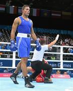 20 June 2015; Joe Joyce, Great Britain, knocks Alexei Zavatin, Moldova, to the canvas for the third time during the first round during their Men's Boxing Super Heavy +91kg Round of 16 bout. 2015 European Games, Crystal Hall, Baku, Azerbaijan. Picture credit: Stephen McCarthy / SPORTSFILE