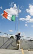 20 June 2015; Longford's John Geelan raises the Tricolour before the game. GAA Football All-Ireland Senior Championship, Round 1A, Longford v Carlow, Glennon Brothers Pearse Park, Longford. Picture credit: Ray McManus / SPORTSFILE