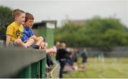 20 June 2015; Two young fans watch the match. GAA Football All-Ireland Senior Championship, Round 1A, London v Cavan, Páirc Smárgaid, Ruislip, London, England. Picture credit: Seb Daly / SPORTSFILE