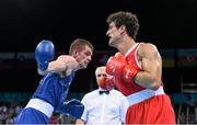 20 June 2015; Adam Nolan, Ireland, left, exchanges punches with Dario Morello, Italy, during their Men's Boxing Welter 69kg Round of 16 bout. 2015 European Games, Crystal Hall, Baku, Azerbaijan. Picture credit: Stephen McCarthy / SPORTSFILE