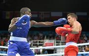 20 June 2015; Souleymane Cissokho, France, left, exchanges punches with Balazs Bacskai, Hungary, during their Men's Boxing Welter 69kg Round of 16 bout. 2015 European Games, Crystal Hall, Baku, Azerbaijan. Picture credit: Stephen McCarthy / SPORTSFILE