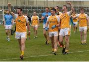 20 June 2015; Antrim players from left, Conor Murray, Patrick McBride, and Owen Gallagher celebrate after the game.  GAA Football All-Ireland Senior Championship, Round 1A, Laois v Antrim, O'Moore Park, Portlaoise, Co. Laois. Picture credit: Piaras Ó Mídheach / SPORTSFILE