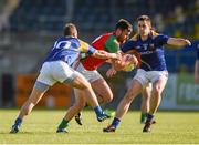 20 June 2015; Eoghan Ruth, Carlow, in action against Kevin Diffley and Peter Foy, left, Longford. GAA Football All-Ireland Senior Championship, Round 1A, Longford v Carlow, Glennon Brothers Pearse Park, Longford. Picture credit: Ray McManus / SPORTSFILE