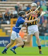 21 June 2015; Joey Cuddihy, Kilkenny, in action against Joe Geaney, Laois. Electric Ireland Leinster GAA Hurling Minor Championship, Semi-Final, Kilkenny v Laois, Nowlan Park, Kilkenny. Picture credit: Piaras Ó Mídheach / SPORTSFILE