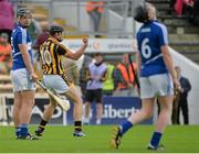 21 June 2015; Andy Gaffney, Kilkenny, celebrates after scoring his sides first goal, as Conor Phelan, left, and Denis Cahill, Laois, look on dejected. Electric Ireland Leinster GAA Hurling Minor Championship, Semi-Final, Kilkenny v Laois, Nowlan Park, Kilkenny. Picture credit: Piaras Ó Mídheach / SPORTSFILE