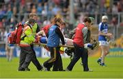21 June 2015; Denis Cahill, Laois, is helped from the field after picking up an injury in the first half. Electric Ireland Leinster GAA Hurling Minor Championship, Semi-Final, Kilkenny v Laois, Nowlan Park, Kilkenny. Picture credit: Piaras Ó Mídheach / SPORTSFILE