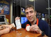 29 August 2008; Olympic boxing silver medalist Kenny Egan collects his winnings at the Boylesports shop in Neilstown. Kenny collected his winnings after he placed a bet on himself to win a medal in Beijing. Boylesports generously trebled his winnings and gave the same amount to Kenny’s club in Neilstown to prepare the boxers of the future. Boylseports, Clondalkin, Dublin. Picture credit: Brian Lawless / SPORTSFILE