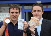 29 August 2008; Olympic boxing silver medalist Kenny Egan with Leon Blanche from Boylesports at the Boylesports shop in Neilstown. Kenny collected his winnings after he placed a bet on himself to win a medal in Beijing. Boylesports generously trebled his winnings and gave the same amount to Kenny’s club in Neilstown to prepare the boxers of the future. Boylseports, Clondalkin, Dublin. Picture credit: Brian Lawless / SPORTSFILE