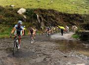 30 August 2008; A general view of the peloton crossing a flooded road at Slea Head, Co. Kerry. 2008 Tour of Ireland - Stage 4, Limerick - Dingle. Picture credit: Stephen McCarthy / SPORTSFILE