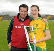 21 June 2015; Donegal Manager Davy McLaughlin and Captain Emer Gallagher pose with the trophy after their team's victory. Aisling McGing U21 B Championship Final, Donegal v Longford, Markiewicz Park, Sligo. Picture credit: Seb Daly / SPORTSFILE
