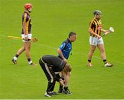 21 June 2015; Referee Diarmuid Kirwan is treated for an injury suffered at the start of the second half by Kilkenny team doctor Tadhg Crowley. Leinster GAA Hurling Senior Championship, Semi-Final, Kilkenny v Wexford, Nowlan Park, Kilkenny. Picture credit: Piaras Ó Mídheach / SPORTSFILE