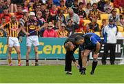 21 June 2015; Referee Diarmuid Kirwan, receives treatment after falling to the ground at the start of the second half between Wexford and   Kilkenny. Leinster GAA Hurling Senior Championship, Semi-Final, Kilkenny v Wexford, Nowlan Park, Kilkenny. Picture credit: David Maher / SPORTSFILE