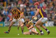 21 June 2015; Richie Hogan, Kilkenny, supported by team-mate Conor Fogarty, action against Lee Chin, Wexford. Leinster GAA Hurling Senior Championship, Semi-Final, Kilkenny v Wexford, Nowlan Park, Kilkenny. Picture credit: Piaras Ó Mídheach / SPORTSFILE