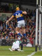 21 June 2015; Seamus Callanan jumps out over the Limerick goalkeeper Barry Hennessy as he celebrates scoring the second tipperary goal in the 22nd minute.  Munster GAA Hurling Senior Championship, Semi-Final, Limerick v Tipperary, Gaelic Grounds, Limerick. Picture credit: Ray McManus / SPORTSFILE