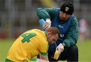 21 June 2015; Ronan McDermott, Donegal being attended to by Donegal Physio Colm O'Neill. Ulster GAA Hurling Senior Championship, Quarter-Final, Donegal v Derry, Celtic Park, Derry. Picture credit: Oliver McVeigh / SPORTSFILE