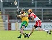 21 June 2015; Kevin Campbell, Donegal, in action against Michael Warnock, Derry. Ulster GAA Hurling Senior Championship, Quarter-Final, Donegal v Derry, Celtic Park, Derry. Picture credit: Oliver McVeigh / SPORTSFILE