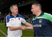 21 June 2015; Tipperary manager Eamon O'Shea, left, shakes hands with Limerick manager TJ Ryan after the final whistle. Munster GAA Hurling Senior Championship, Semi-Final, Limerick v Tipperary, Gaelic Grounds, Limerick. Picture credit: Brendan Moran / SPORTSFILE