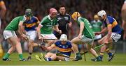 21 June 2015; Niall O'Meara, supported by his Tipperary team mate Patrick Maher, tries to lift the sliothar under pressure from Limerick players Stephen Walsh, left, Paudie O'Brien, 9, and Seanie O'Brien. Munster GAA Hurling Senior Championship, Semi-Final, Limerick v Tipperary, Gaelic Grounds, Limerick. Picture credit: Ray McManus / SPORTSFILE