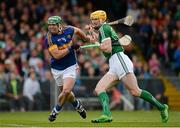 21 June 2015; John O'Dwyer, Tipperary, is restrained by Seamus Hickey, Limerick, as they watch a loose ball. Munster GAA Hurling Senior Championship, Semi-Final, Limerick v Tipperary, Gaelic Grounds, Limerick. Picture credit: Brendan Moran / SPORTSFILE