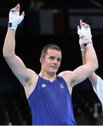 21 June 2015; Darren O'Neill, Ireland, is declared victorious over Raitisw Sinkevics, Latvia, following their Men's Boxing Heavy 91kg bout. 2015 European Games, Crystal Hall, Baku, Azerbaijan. Picture credit: Stephen McCarthy / SPORTSFILE