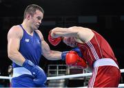 21 June 2015; Darren O'Neill, Ireland, left, exchanges punches with Raitis Sinkevics, Latvia, during their Men's Boxing Heavy 91kg Round of 16 bout. 2015 European Games, Crystal Hall, Baku, Azerbaijan. Picture credit: Stephen McCarthy / SPORTSFILE