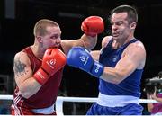21 June 2015; Raitis Sinkevics, Latvia, left, exchanges punches with Darren O'Neill, Ireland, during their Men's Boxing Heavy 91kg Round of 16 bout. 2015 European Games, Crystal Hall, Baku, Azerbaijan. Picture credit: Stephen McCarthy / SPORTSFILE